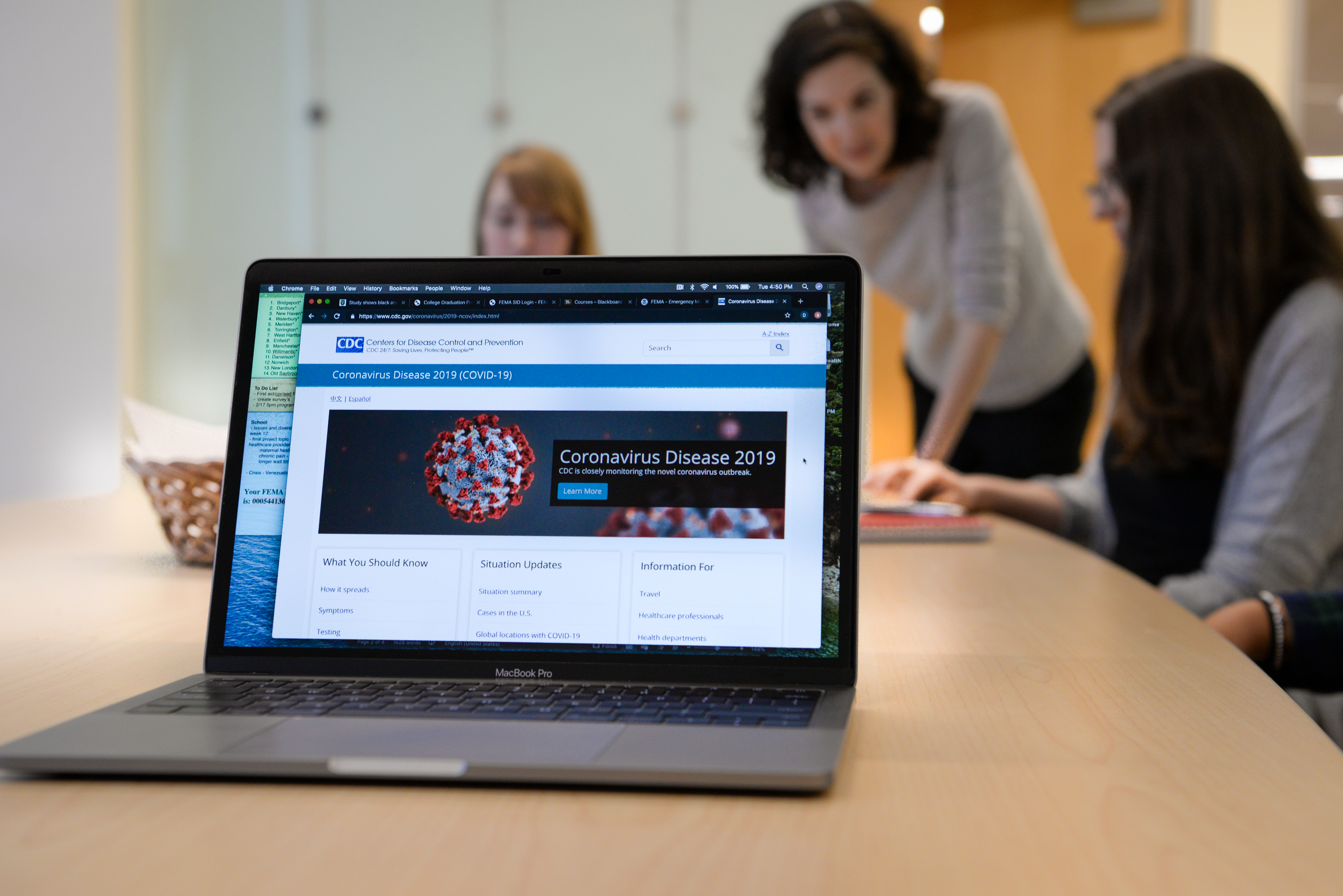 laptop displaying a CDC webpage about the coronavirus